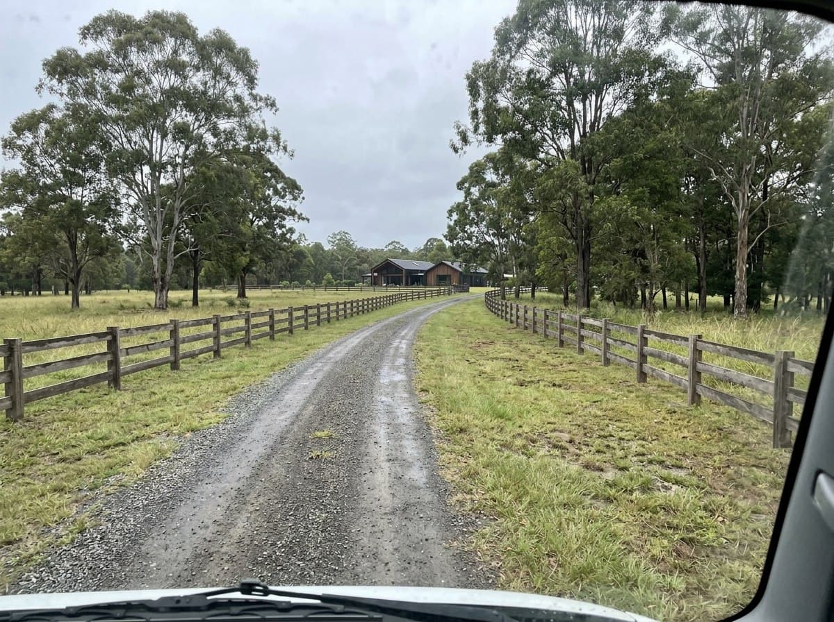 Bare gravel acreage driveway in Doonan before planting