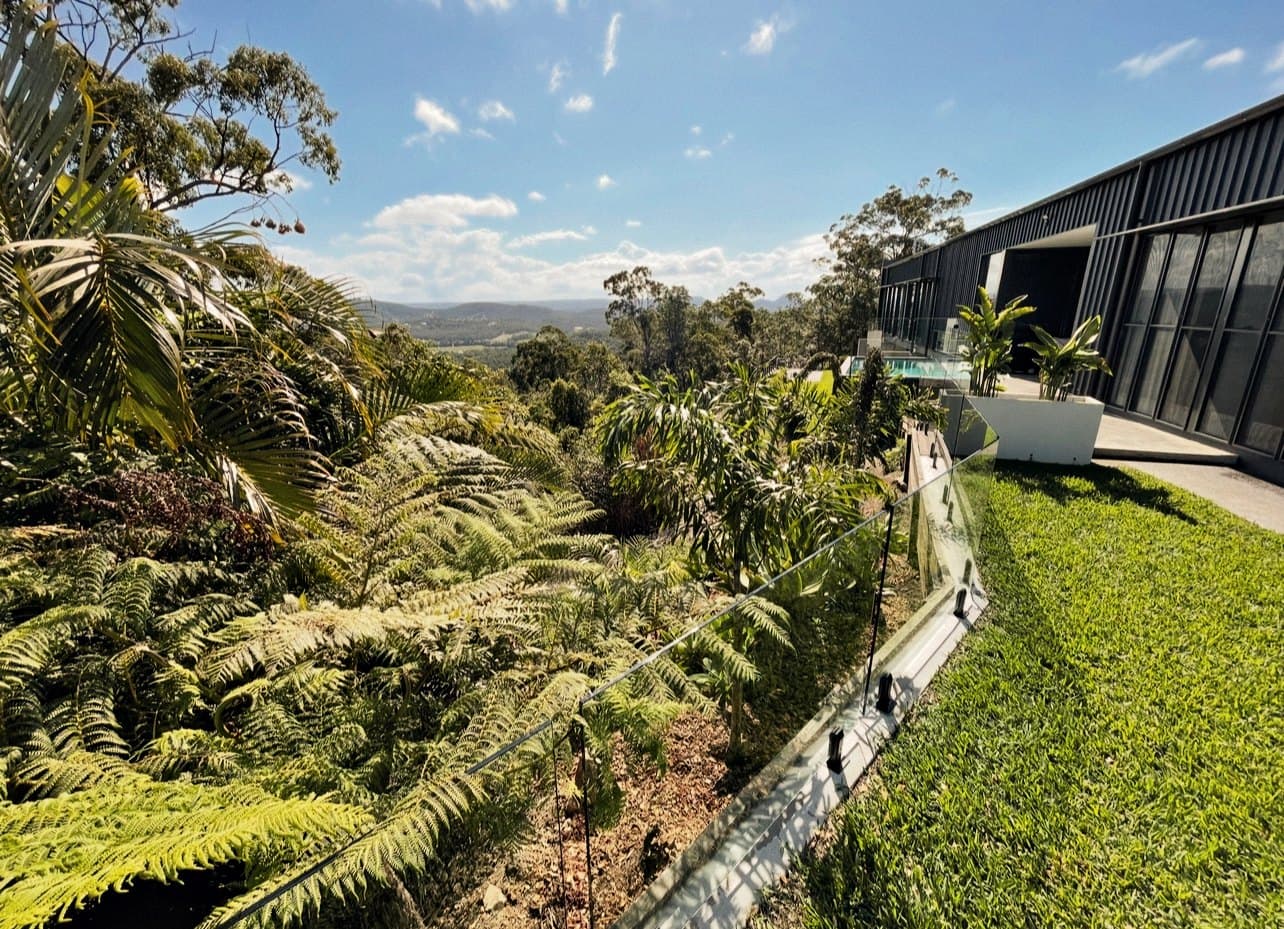 Manicured estate garden with clipped hedging and curved lawn