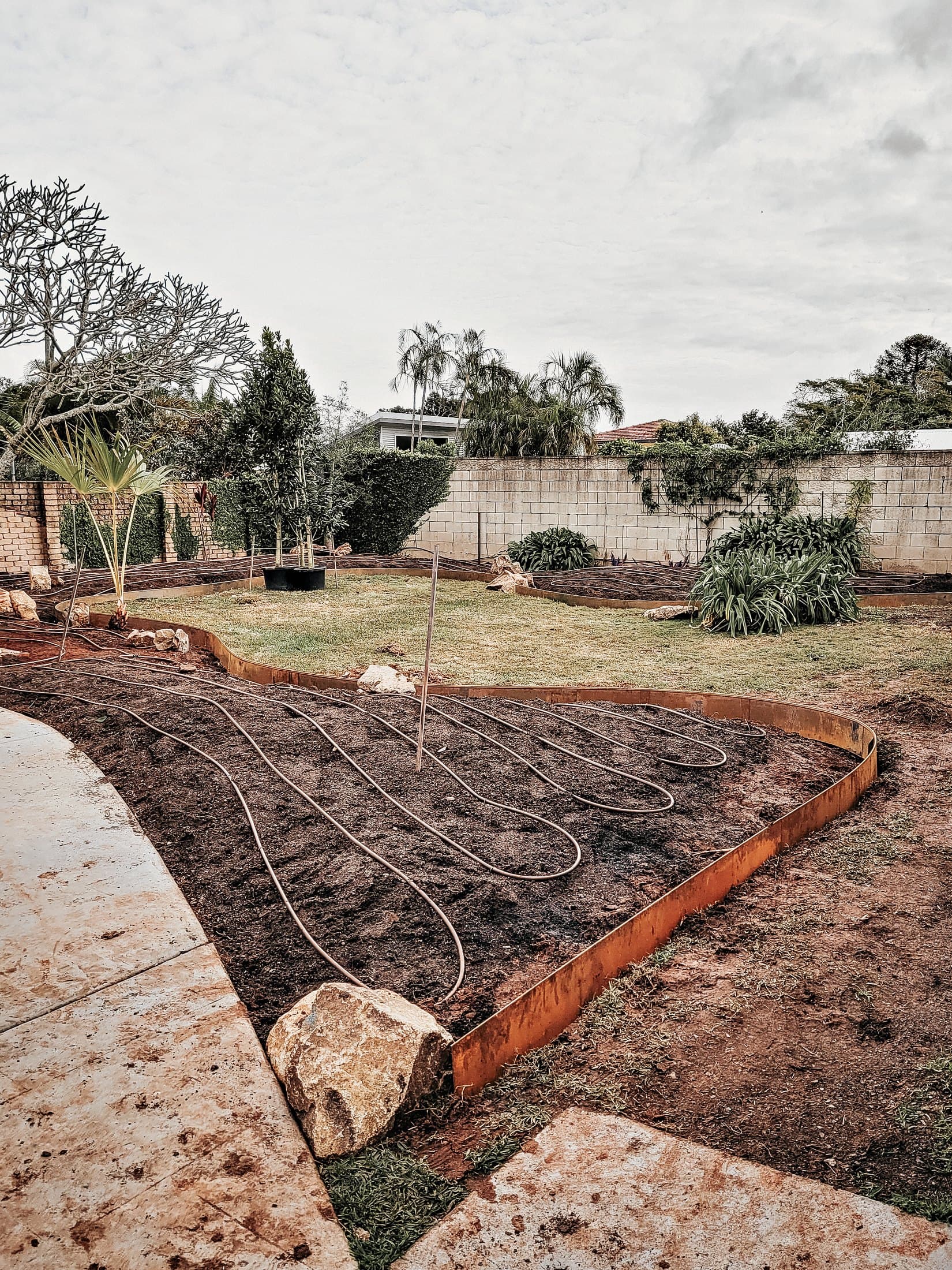 Garden bed cleared and reshaped with new timber edging