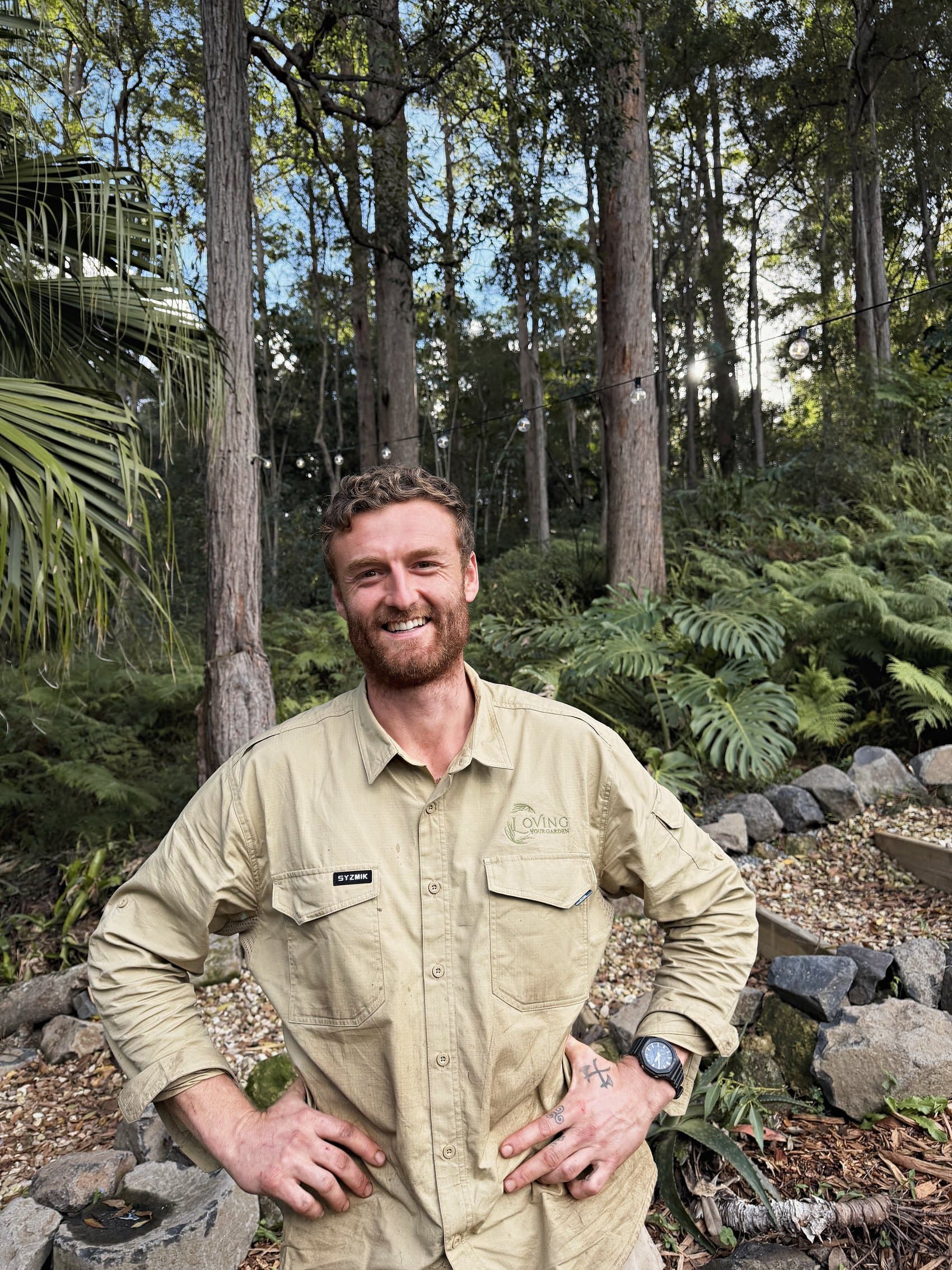 Chris Dowsett, founder of Loving Your Garden, smiling in a client garden